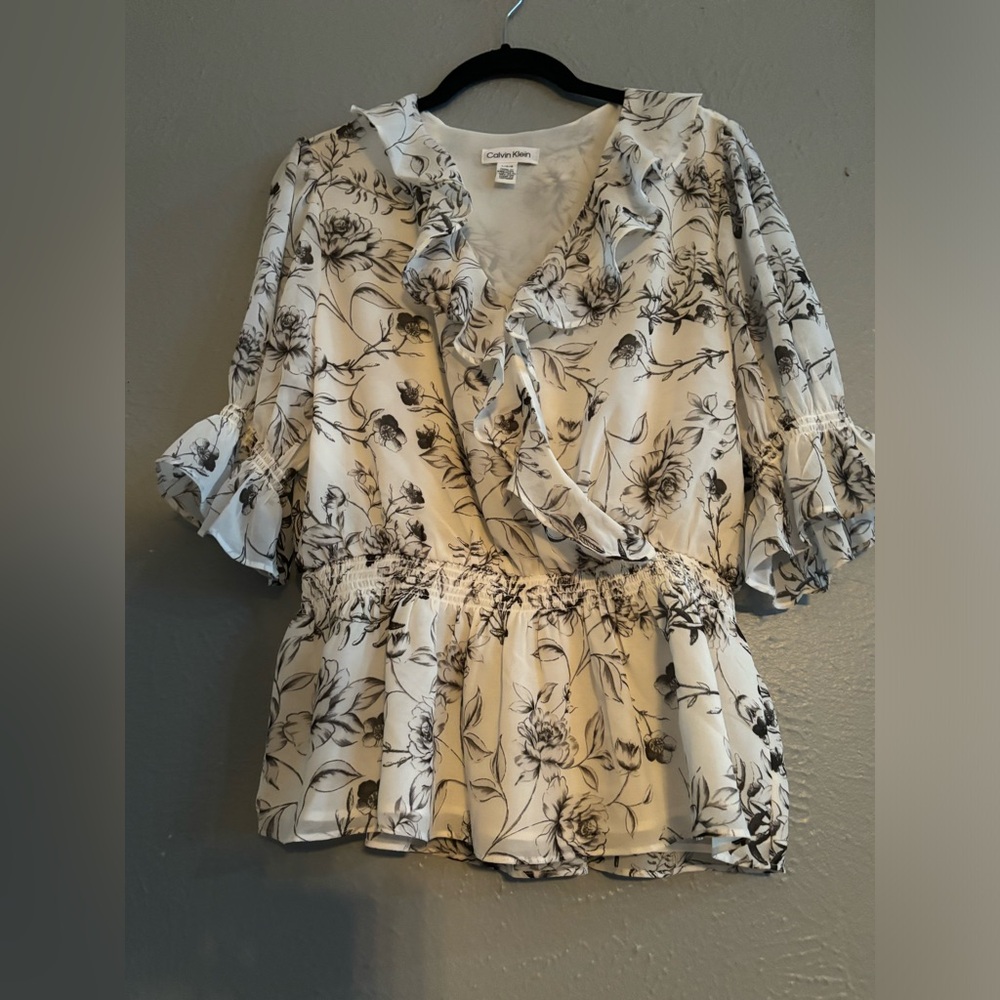 Calvin Klein women’s blouse size: large with floral print and ruffles